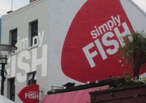 Simply Fish restaurant exterior - side on view of branding